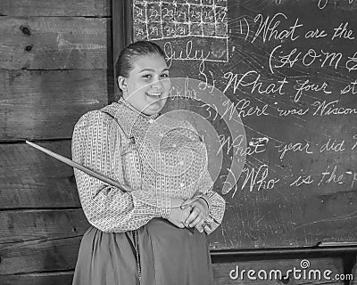 Teacher with Chalkboard, Cursive Handwriting Editorial Stock Photo