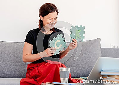 Teacher demonstrating visual material during online lesson Stock Photo