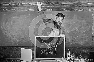 Teacher or educator welcomes inscription back to school. Full of energy after summer school holidays. Welcome back to Stock Photo