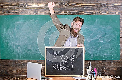 Teacher or educator welcomes inscription back to school. Full of energy after summer school holidays. Welcome back to Stock Photo