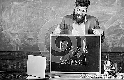 Teacher experienced educator welcomes new enrollees to begin study and get education. Never late to study. Teacher or Stock Photo