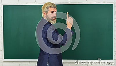 Teacher explain topic. Man teacher in front of chalkboard copy space. Announcement of free courses. Advertisement Stock Photo