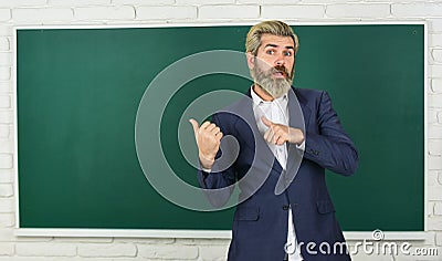 Teacher explain topic. Man teacher in front of chalkboard. Have good grade point average in high school. Teacher friend Stock Photo