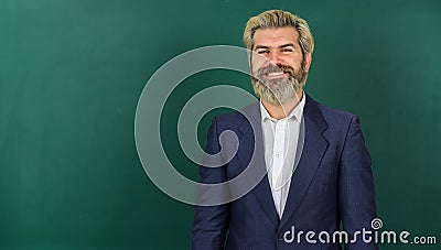 Teacher explain topic. Teachers enlighten path of success. Man teacher in front of chalkboard copy space. Announcement Stock Photo