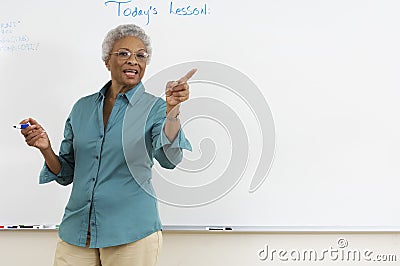 Teacher Explaining In The Classroom Stock Photo