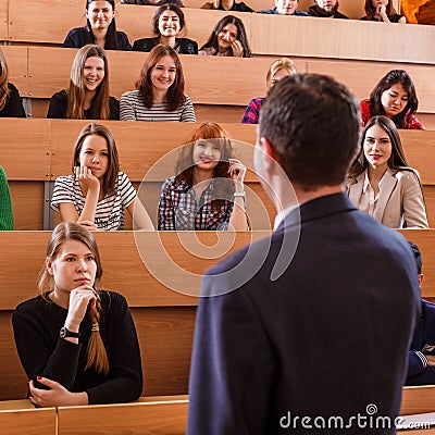 Teacher explaining something to students Stock Photo