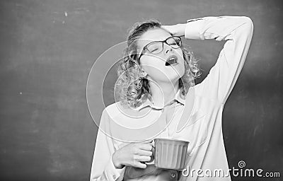Teacher eyeglasses drink coffee chalkboard background. Woman enjoy coffee before classes. Sip recharging body and mind Stock Photo