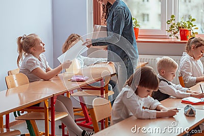 Teacher gives the student a tested Stock Photo