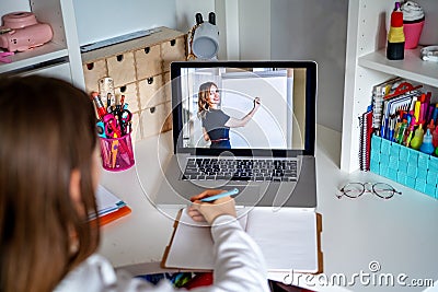 Teacher giving lesson online on video chat. Teenager girl studying at home looking at tutor at laptop screen Stock Photo