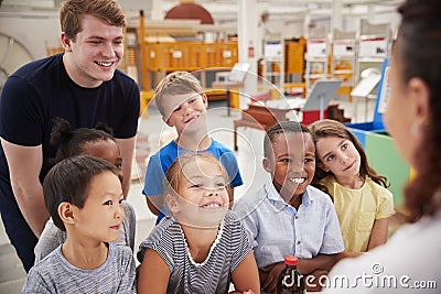 Teacher and kids having fun at a science centre Stock Photo