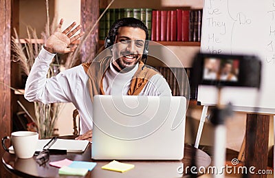 Teacher At Laptop Teaching English Online Making Video Lesson Indoors Stock Photo