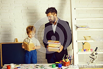 Teacher and preschooler. Books and reading. Education and tales. Stock Photo