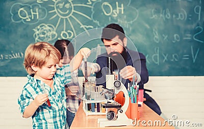 Teacher and pupils with test tubes in classroom. Interesting school classes. School education. School chemistry Stock Photo