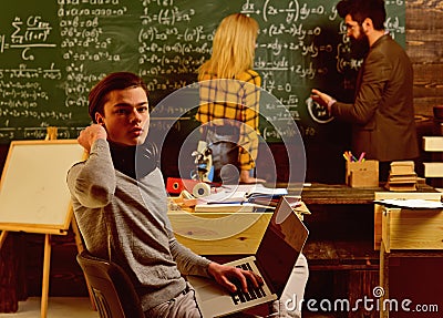 Teacher puts marks sends feedbacks on email with laptop computer. Professional tutors are experts in their academic Stock Photo