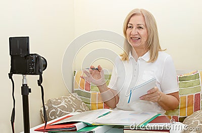 Teacher is recording video tutorials for her video blog Stock Photo