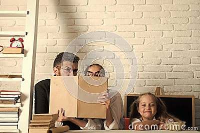 Teacher and schoolgirls on classroom background. Kid with happy face Stock Photo
