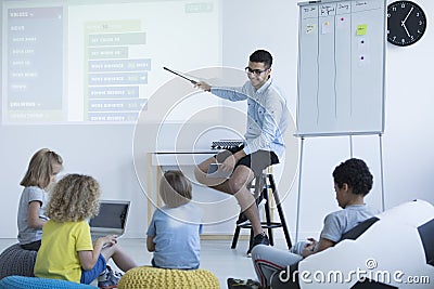 Teacher shows on an interactive whiteboard Stock Photo