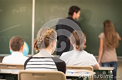 RTeacher teaching or educate at the board a class in schoolr Stock Photo