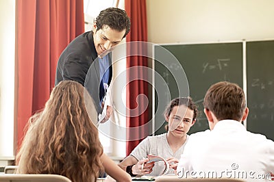 Teacher teaching or educate at the board a class in school Stock Photo