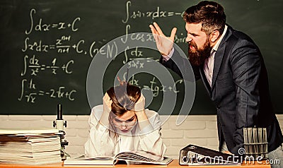 Teacher strict serious bearded man having conflict with student girl. Conflict situation. School conflict. Demanding Stock Photo