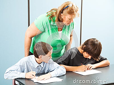 Teacher Supervises Testing Stock Photo