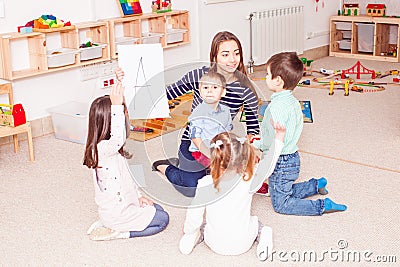 Teacher teaches preschoolers Stock Photo