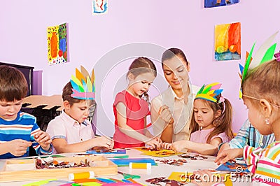 Teacher work with kids in art preschool class Stock Photo