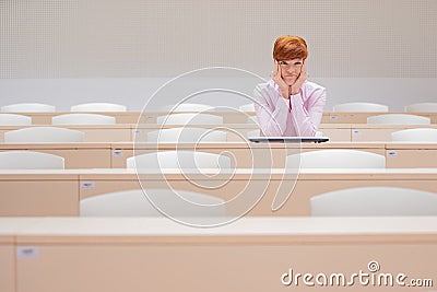 student in high school auditorium at school with white laptop Stock Photo