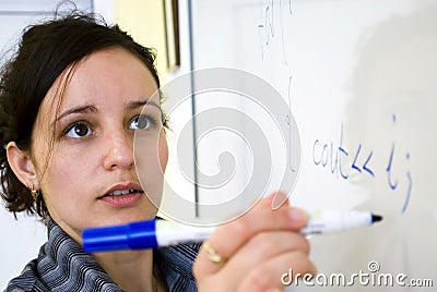 Teacher writing Stock Photo