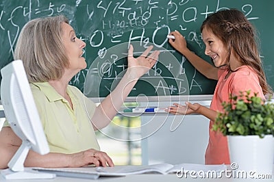 Teachers working with pupil Stock Photo