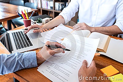 Teaching helping and study course, Team of young teacher or tutor helps students to learning in classroom for homework a test or Stock Photo