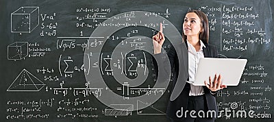 Teaching students concept with young professor with laptop on blackboard background Stock Photo