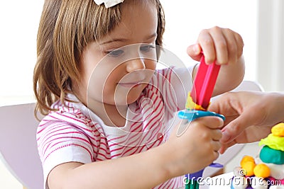 Teaching to use play dough Stock Photo