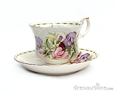 Teacup and Saucer with Sweet Peas Stock Photo