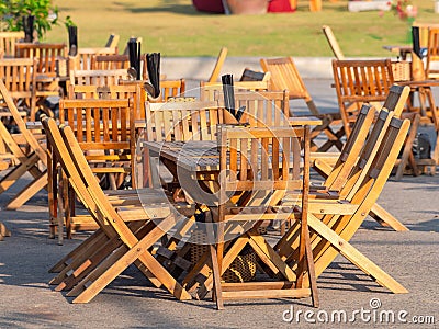 Teak furniture at outdoor restaurant Stock Photo