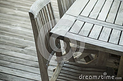 Teak garden furniture on a wooden terrace in spring Stock Photo