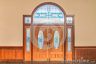 Teak wooden door with beautiful stained glass interior for home and living architecture vintage decoration cllassic building Stock Photo