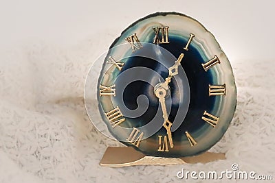 Teal agate geode clock on soft white background Stock Photo