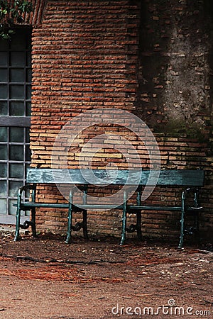 Teal Color Iron bench in a deserted place Stock Photo