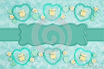 Teal frame hearts, teddy bears and rose buds on pale teal rose plush fabric with ribbon background Stock Photo
