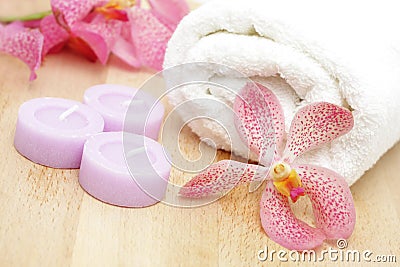 Tealight candles and white towel Stock Photo