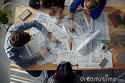 Team of Architects Collaboratively Designing Innovative Building Plans with Precision and Creativity, Utilizing Advanced Stock Photo