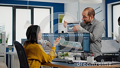 Team of architects and engineers working on building prototype project Stock Photo