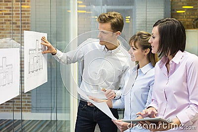 Team of architects working in office on constructi Stock Photo
