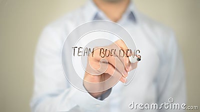 Team Building, Man Writing on Transparent Screen Stock Photo