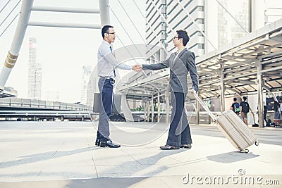 Team Business Partners shaking hands together to Greeting Start up new project. Corporate Teamwork Partnership outside office Stock Photo