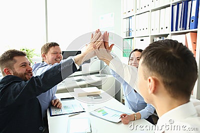 Team of business people at negotiating table successfully solves problems of project Stock Photo