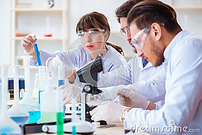 The team of chemists working in the lab Stock Photo