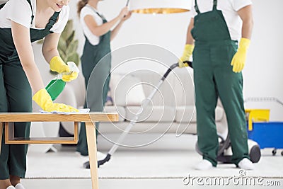 Team of cleaners cleaning room Stock Photo