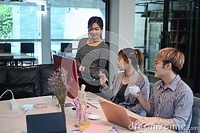 Team of coders brainstorming ideas for developing website design and coding technologies at modern office Stock Photo